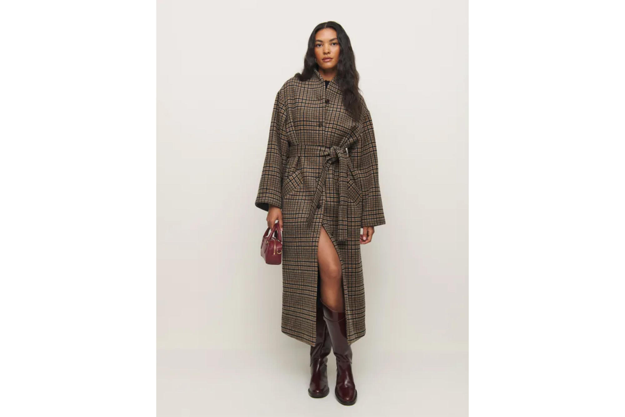 A model in a plaid coat