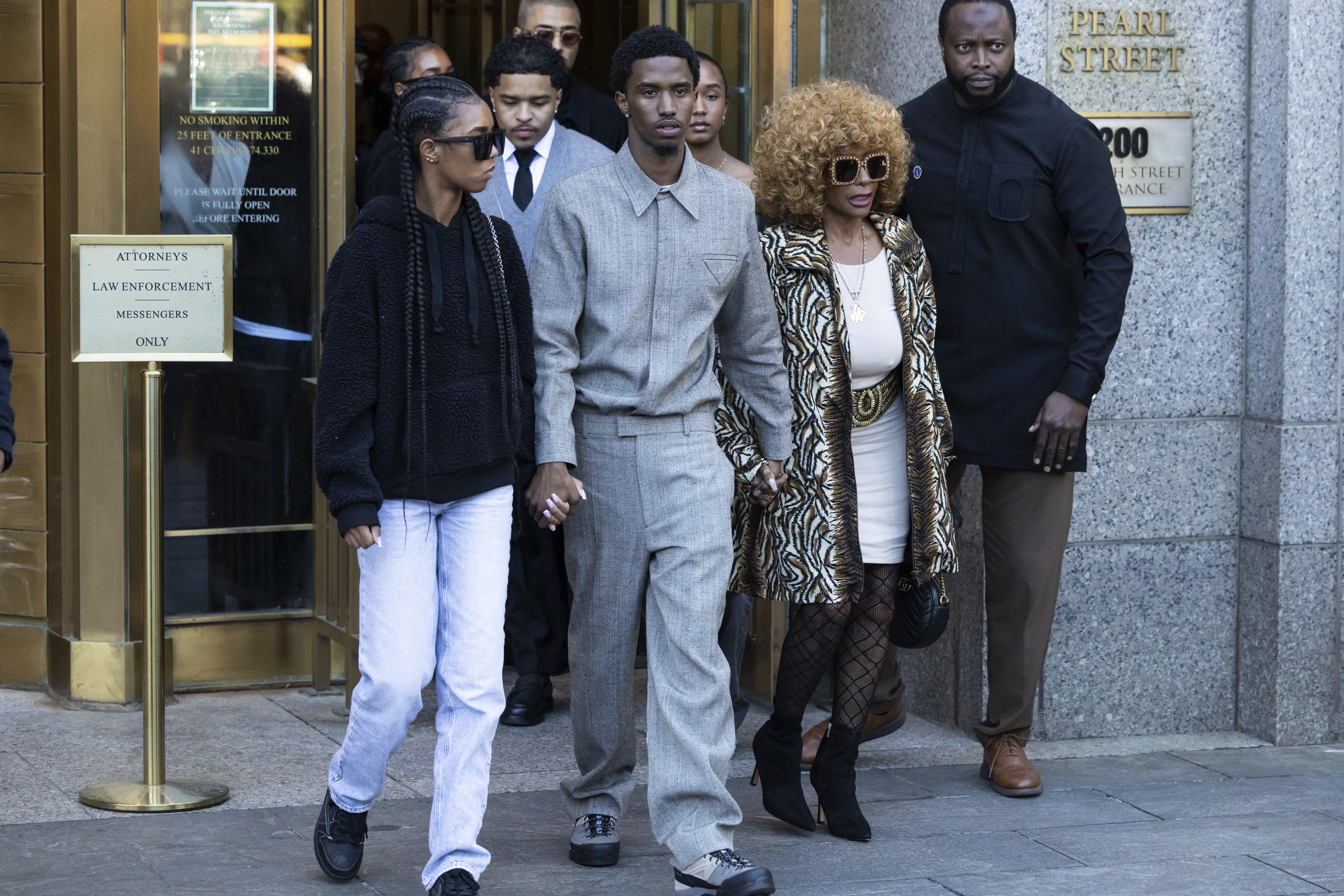 Sean "Diddy" Combs kids and his mom outside of a courthouse.