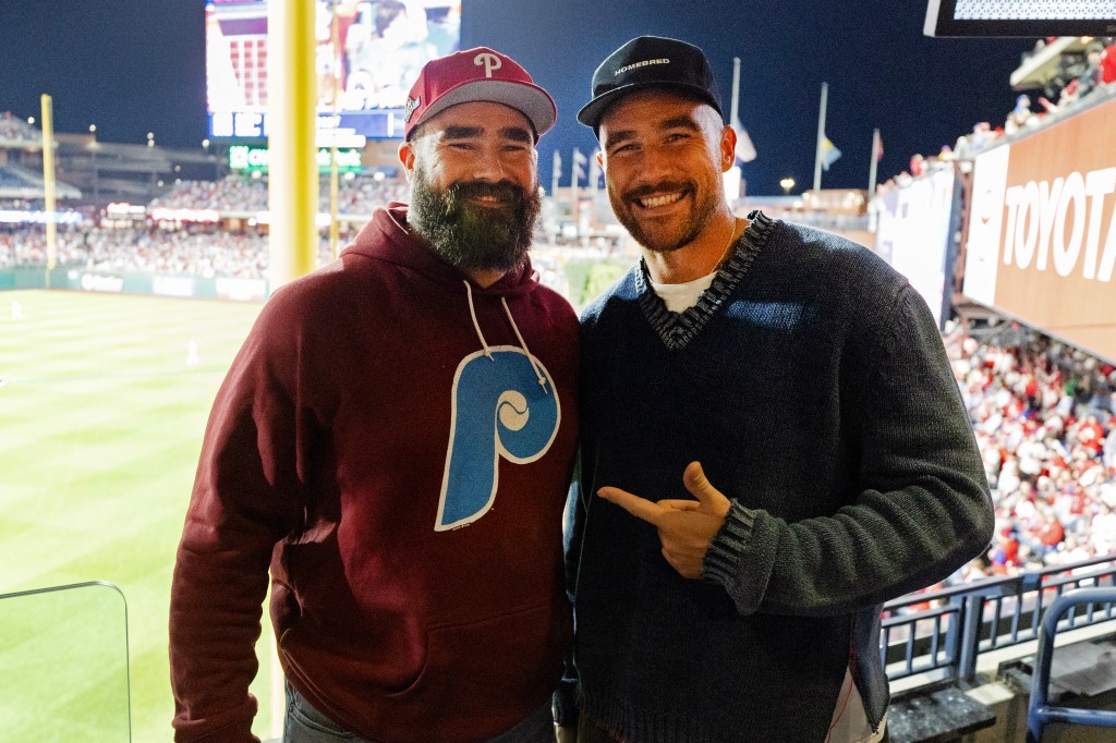 Jason and Travis Kelce at a football stadium. 