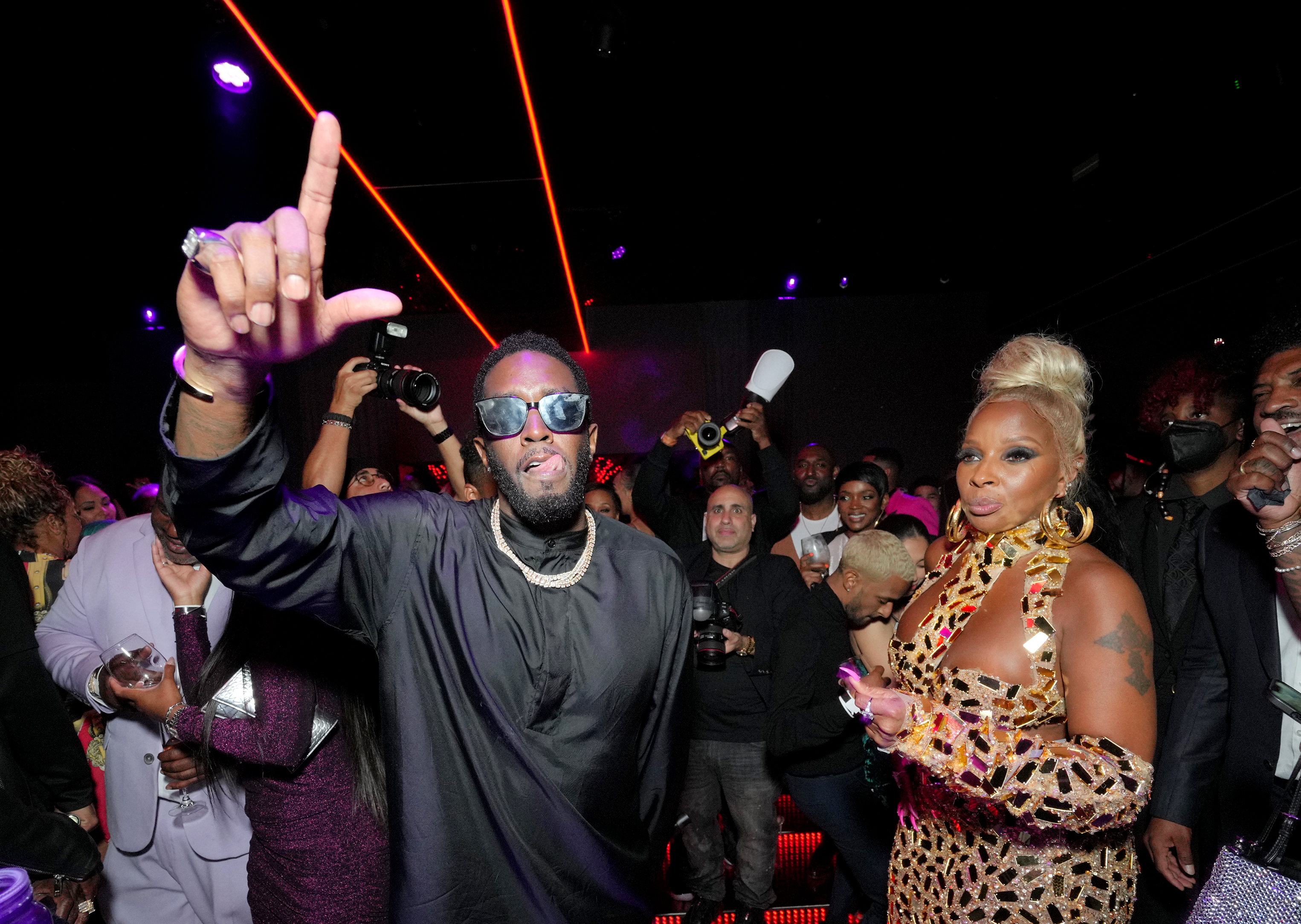 Sean "Diddy" Combs and Mary J. Blige at a party.