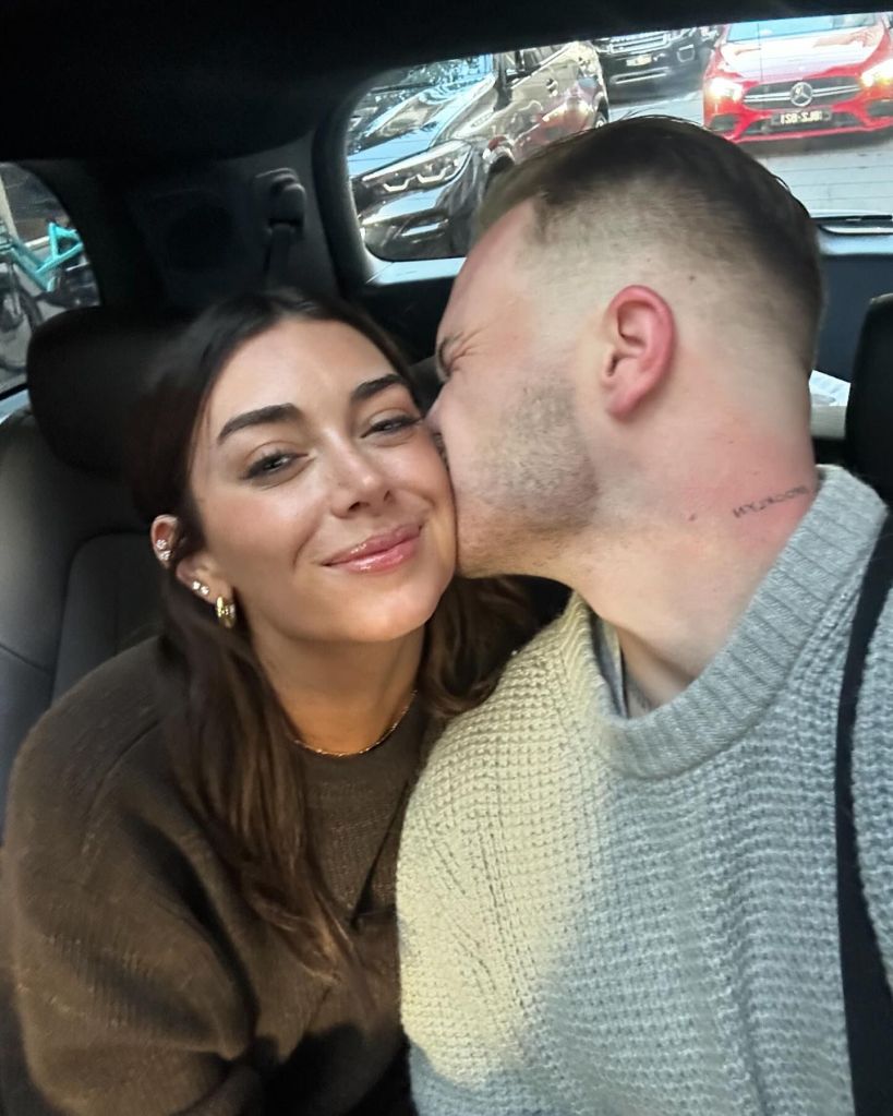 Zach Bryan and girlfriend Brianna share a kiss