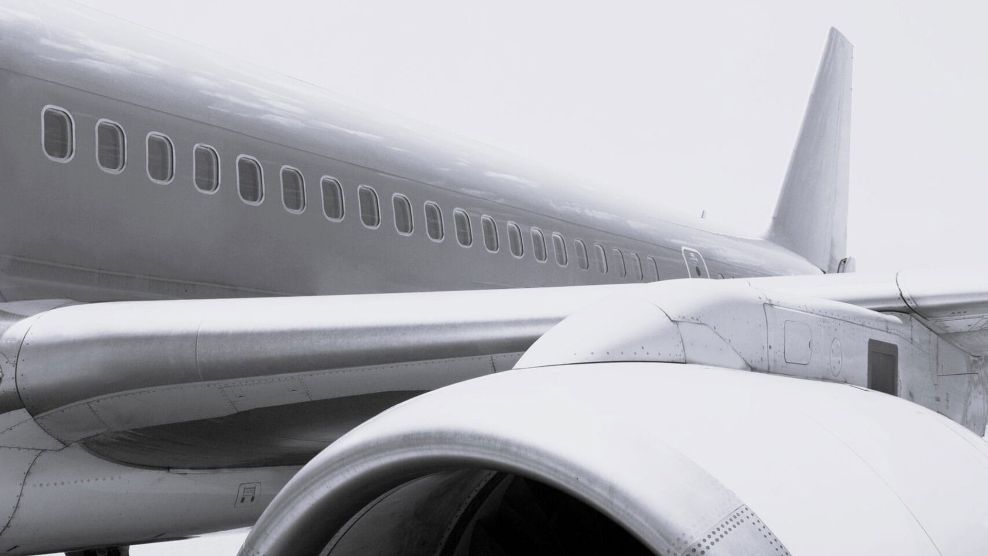 Black and white image of an airplane on the runway