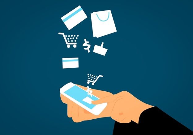 a hand holding a smartphone which shows clipart of online shopping symbols