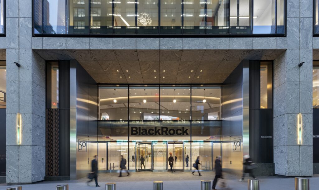 The exterior of Black Rock's New York City headquarters, with people walking by.