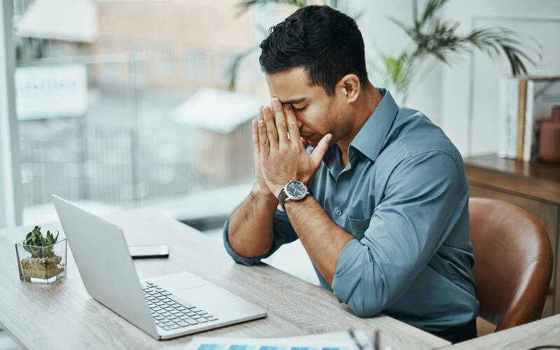 user appearing stressed out at his computer