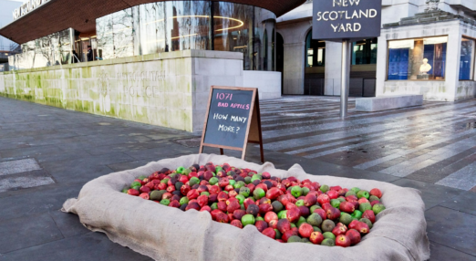 Collection of apples outside New Scotland Yard.