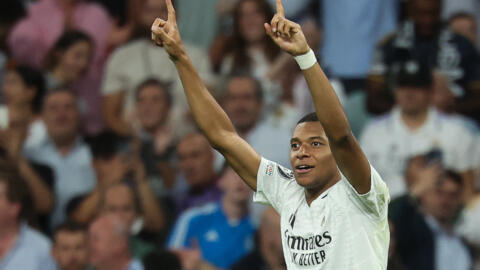 Kylian Mbappe celebrates after scoring for Real Madrid in the UEFA Champions League football match against Stuttgart VFB at the Santiago Bernabeu stadium in Madrid on September 17, 2024.