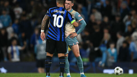 Inter Milan striker Lautaro Martinez greets Manchester City midfielder Phil Foden at the end of their Champions League match on September 18, 2024 at the Etihad Stadium.