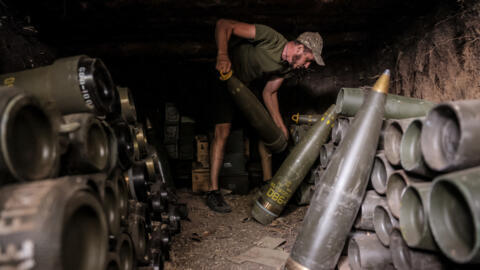 A Ukrainian serviceman prepares shells to fire howitzer towards a Russian position on the front line near Chasiv Yar, Donetsk region, on July 20, 2024.