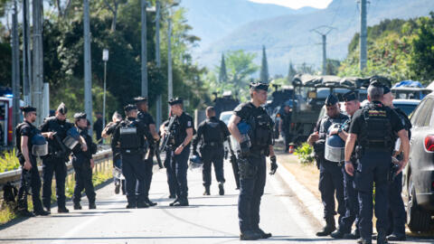 French gendarmes block a road in Mont-Dore, in New Caledonia, on 19 September 2024. 