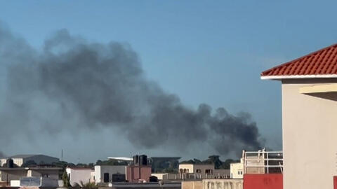 This video grab taken from an AFPTV video shows smoke rising in Bamako, Mali, as shots and detonations were heard on the morning of 17 September, 2024.