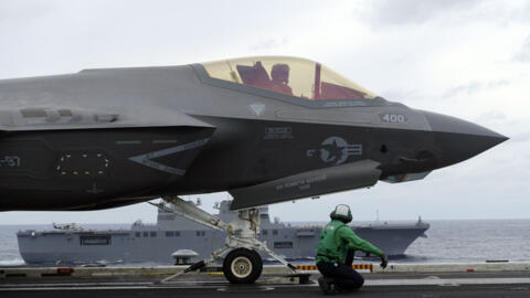 US Navy’s F-35C stealth fighter jet and crew prepare ready for a takeoff for a flight demonstration during the Annualex 23 joint naval exercise, from aircraft carrier USS Carl Vinson off the Japanese