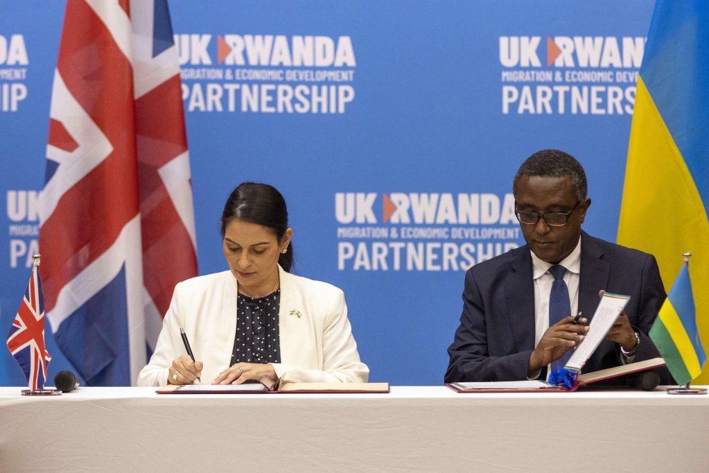 On 14 April 2022, UK Home Secretary Priti Patel (left) and Rwandan Foreign Minister Vincent Biruta (right) sign a new asylum agreement. | Photo: AP
