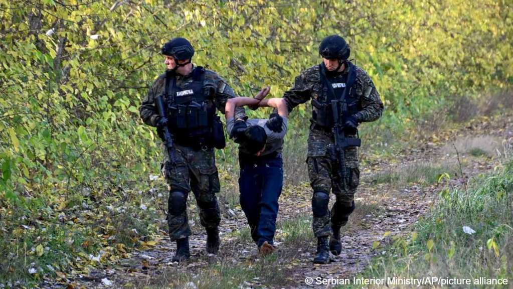 In this photo provided by the Serbian Interior Ministry, police officers detain a migrant near the border between Serbia and Hungary, Serbia, Sunday, Oct. 29, 2023. | Photo: Serbian Ministry of Interior via AP