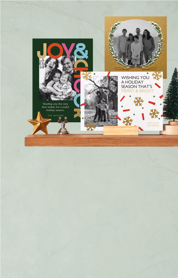 A banner for printed holiday cards from Paper Source. An image shows two options and envelopes.