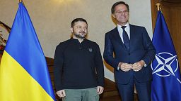 NATO Secretary General Mark Rutte, right, greets Ukraine's President Volodymyr Zelenskyy prior to a meeting in Brussels on Wednesday, Dec. 18, 2024.