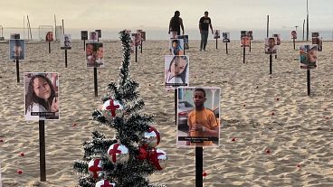 Photos of children lying in the sand who died violent deaths on Copacabana beach in Rio de Janeiro, Brazil, 18.12.2024