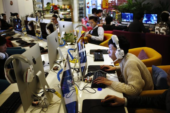 Computer users in an Internet<strong></strong> cafe in Beijing.