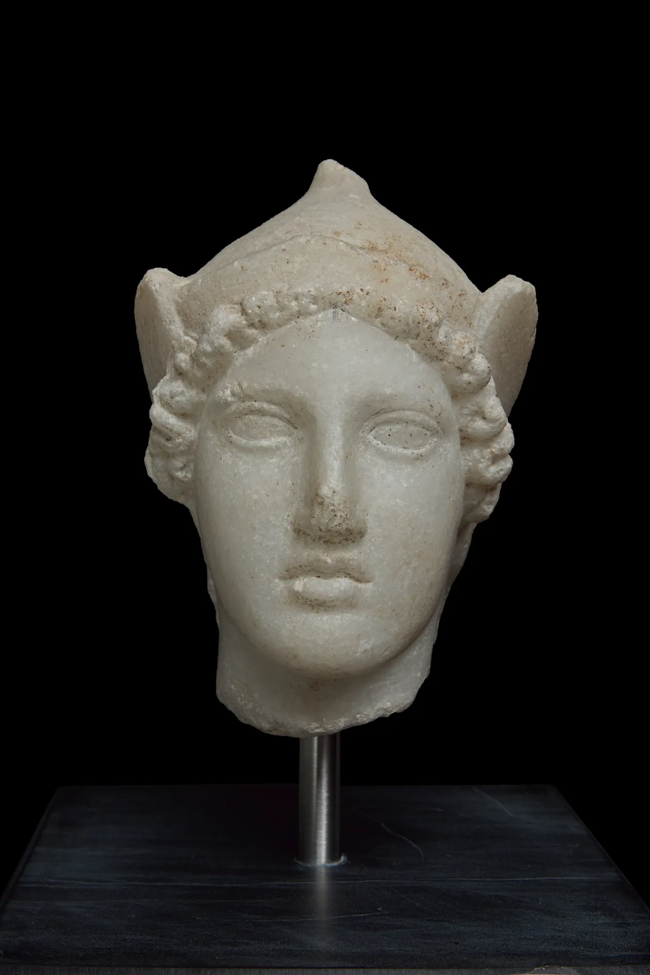 A marble bust capturing the subject's likeness with remarkable detail, showcasing their facial features, hairstyle, and sometimes even clothing or jewelry. The smooth, cool surface of the marble lends an air of elegance and sophistication.