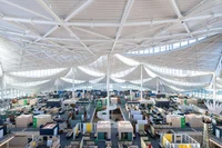 An interior image from the top of an office building with room for thousands of workers.