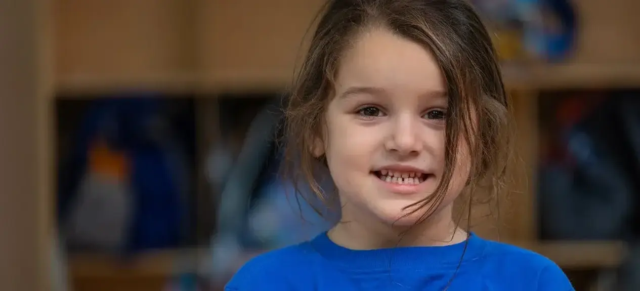 Young girl smiling at the camera