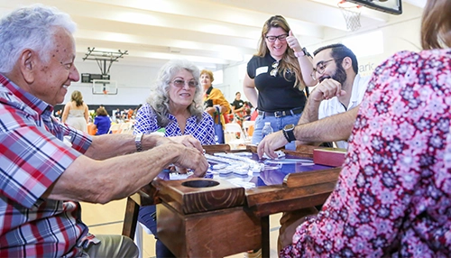 group of seniors socializing at the table