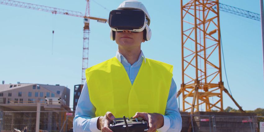 man in yellow vest using augmented reality headset in the field