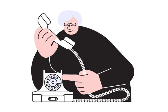 Elderly woman speaking by retro phone.