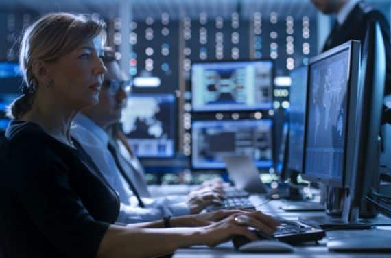 Woman working on a computer in a high-tech room