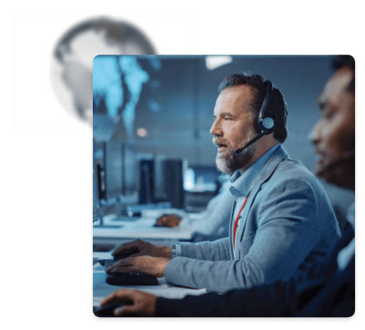 Man talking on a headset using a computer at work