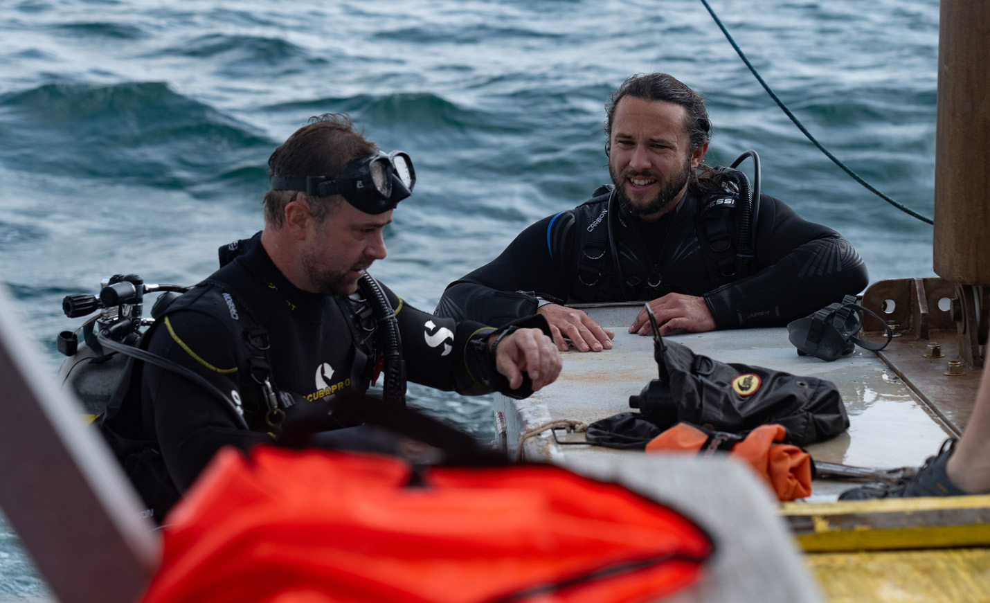 Students helping place buoy out in the ocean