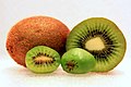 The larger kiwifruit in back compared to the smaller size of the hardy kiwi in front