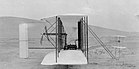 Der Wright Flyer der Brüder Wright vor den Flügen vom 17. Dezember 1903 in Kitty Hawk, North Carolina KW 51 (ab 13. Dezember 2020)