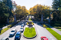 Drone photograph over the Bronze W at the entrance to Memorial Drive on the UW Seattle campus.