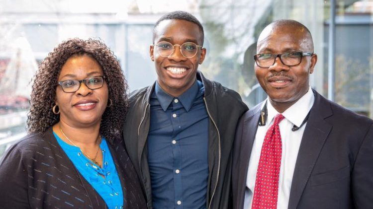 A family poses for a portrait at a UW event