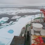 bow of ship with patches of ice and open water