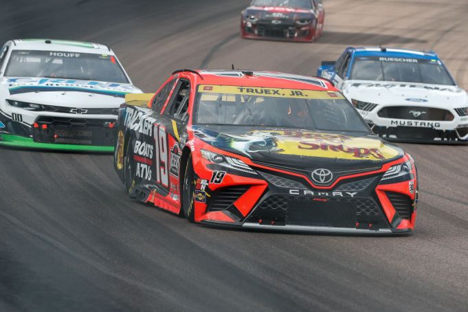 AVONDALE, AZ - NOVEMBER 07:  #19: Martin Truex Jr., Joe Gibbs Racing, Toyota Camry Bass Pro Shops races in fort of #00: Quin Houff, StarCom Racing, Chevrolet Camaro CREEK Enterprises Inc and #17: Chris Buescher, Roush Fenway Racing, Ford Mustang Fastenal during the NASCAR Cup Series championship race on November 7, 2021 at Phoenix Raceway in Avondale, Arizona. (Photo by Kevin Abele/Icon Sportswire via Getty Images)