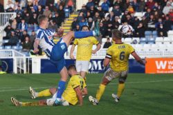 Billy Sass-Davies of Hartlepool United is in action with Brackley Town's Gareth Dean during the FA Cup Fourth Qualifying Round match between Hartlepool United and Brackley Town at Victoria Park in Hartlepool, United Kingdom, on October 12, 2024. (Photo by MI News/NurPhoto via Getty Images)