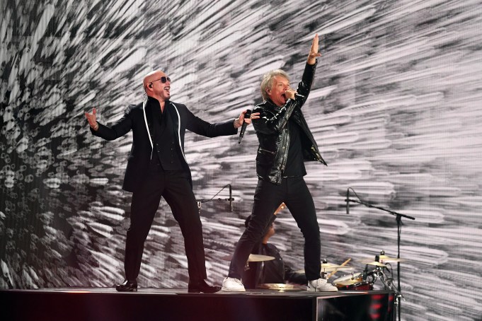 MIAMI, FLORIDA - NOVEMBER 14: EDITORIAL USE ONLY (L-R) Pitbull and Jon Bon Jovi perform onstage during the 25th Annual Latin GRAMMY Awards at Kaseya Center on November 14, 2024 in Miami, Florida. (Photo by Jason Koerner/Getty Images)