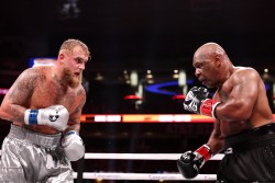 ARLINGTON, TEXAS - NOVEMBER 15: (L-R) Jake Paul and Mike Tyson fight during LIVE On Netflix: Jake Paul vs. Mike Tyson at AT&T Stadium on November 15, 2024 in Arlington, Texas. (Photo by Al Bello/Getty Images for Netflix © 2024)