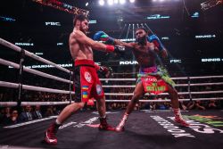 WASHINGTON, DC - JANUARY 07: Jaron Ennis punches Karen Chukhadzhian in their Interim IBF Welterweight Championship bout at Capital One Arena on January 7, 2023 in Washington, DC. (Photo by Patrick Smith/Getty Images)