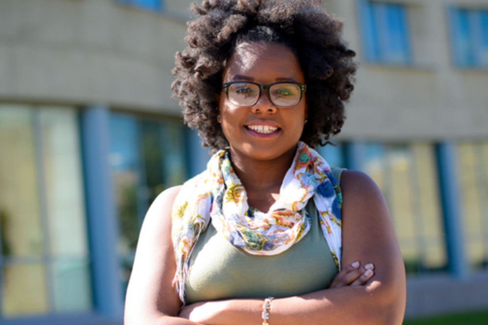 Close up photo of student with their arms crossed