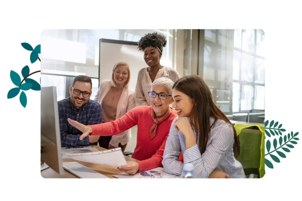 Employees from a nonprofit organization working on a system.