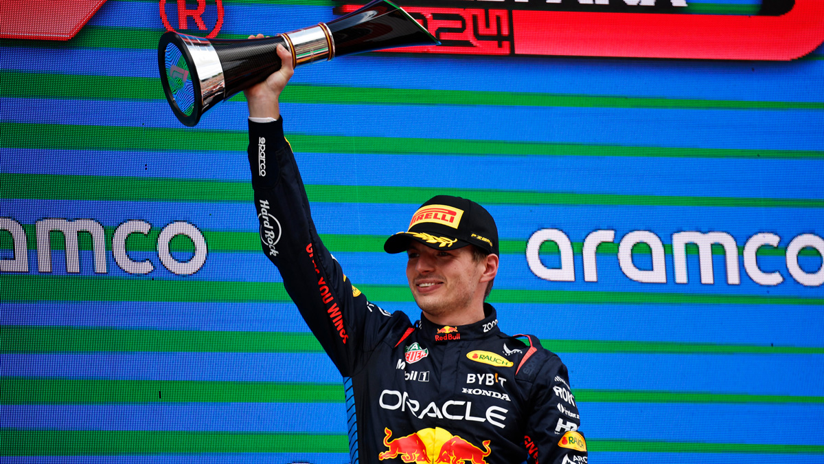 Max Verstappen raises a trophy