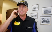 Waffle House president and CEO, Walt Ehmer, speaks on the phone after landing at the Wilmington airport with an emergency response team in Wilmington, N.C., Monday, Sept. 17, 2018. (AP Photo/Steve Helber)