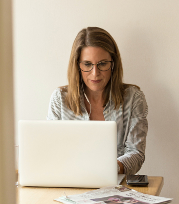 Woman using computer to calculate cyber security risk