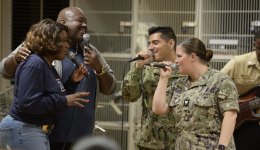 The War and Treaty performs with members of the U.S. Navy.