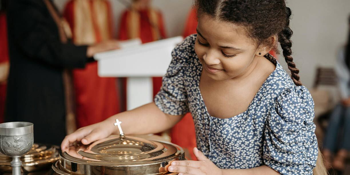 Young girl participating at church service