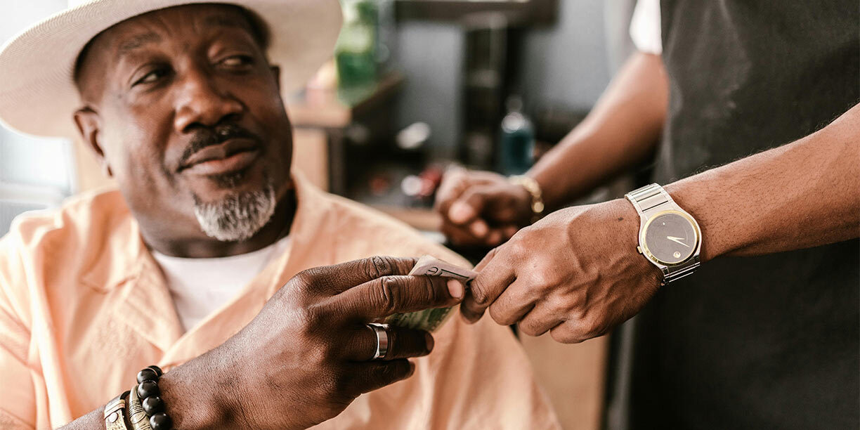 Man exchanging a donation on Giving Tuesday