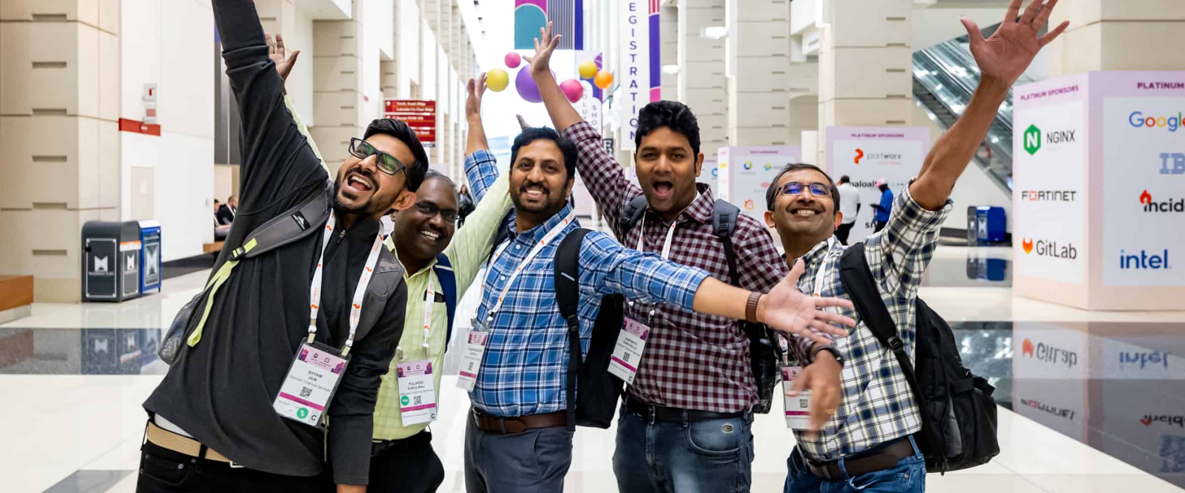 Men cheering at a conference